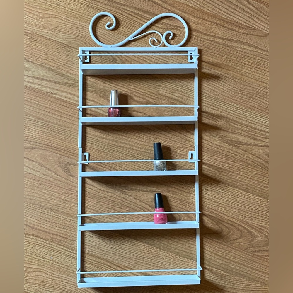 Nail polish wall display rack. White. 22” tall 11” wide.